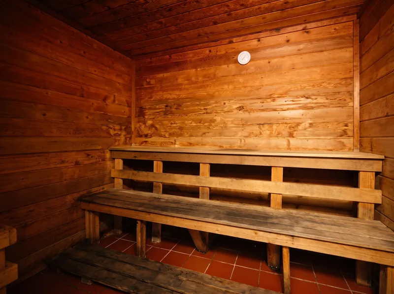 The cedar wood sauna with tiered benches at Foundation Fitness Annapolis