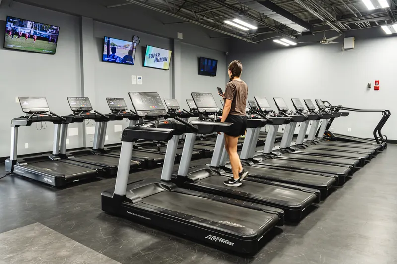 A row of treadmills on the cardio floor at Foundation Fitness Annapolis
