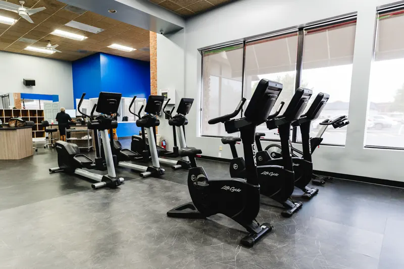 Bikes and ellipticals in the cardio area at Foundation Fitness of Cambridge